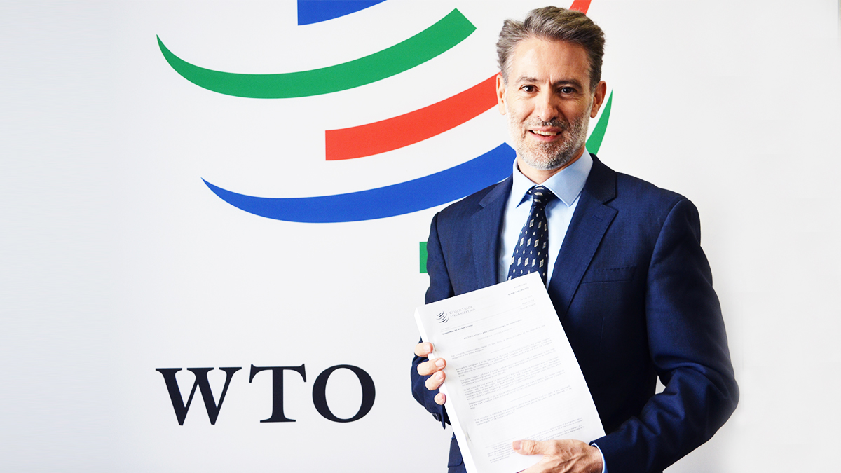 UK Ambassador to the WTO Julian Braithwaite with the UK goods schedule